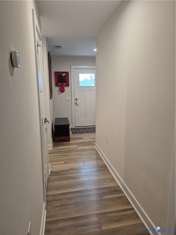 7430 East Danube Loop New Kent, VA 23124 - Photo 18 of 27 a view of a hallway with wooden floor and staircase