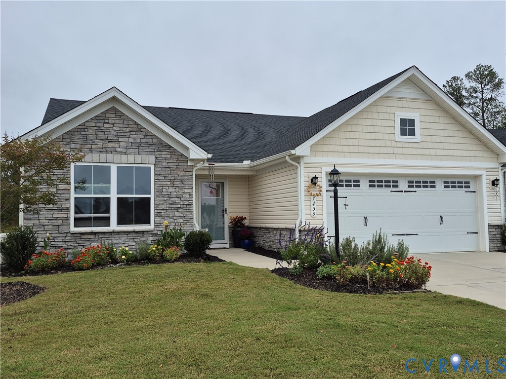 7430 East Danube Loop New Kent, VA 23124 - Photo 2 of 27 View of front of home featuring stone siding, a fr