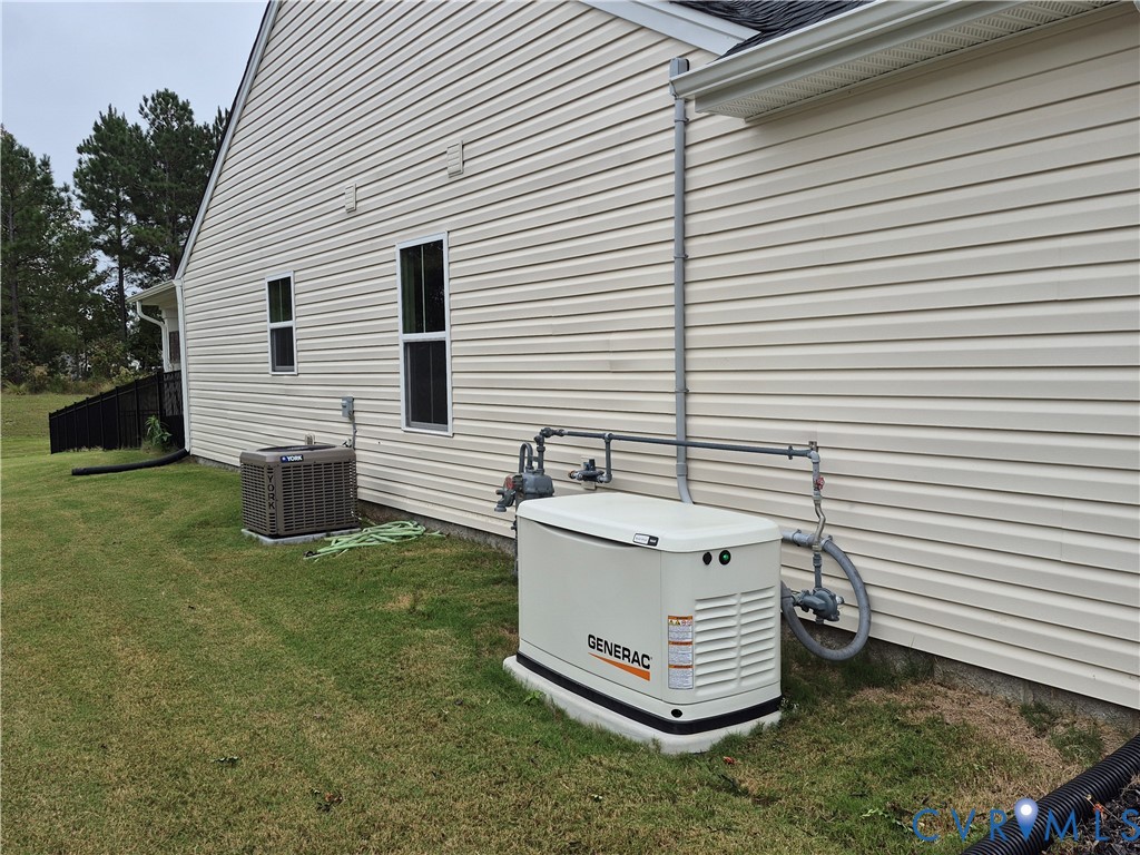 7430 East Danube Loop New Kent, VA 23124 - Photo 3 of 27 View of side of property featuring a central air c