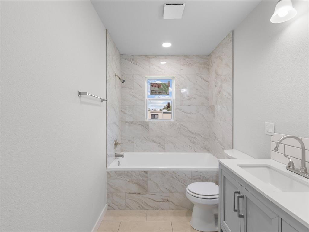 526 Jack Grace Hill Road Bowie, TX 76230 - Photo 12 of 34 a bathroom with a sink toilet and shower