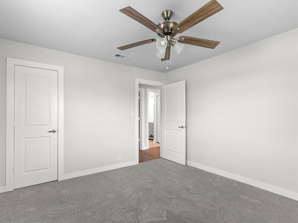 526 Jack Grace Hill Road Bowie, TX 76230 - Photo 14 of 34 an empty room with chandelier fan
