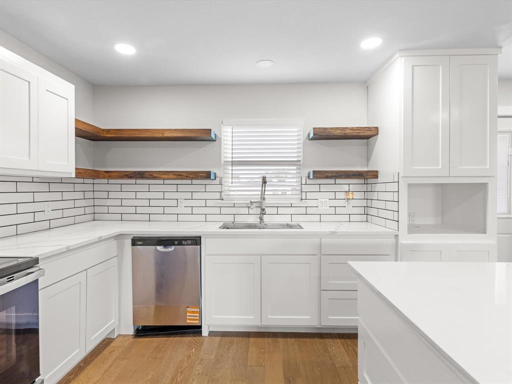 526 Jack Grace Hill Road Bowie, TX 76230 - Photo 20 of 34 a kitchen that has a sink and a stove