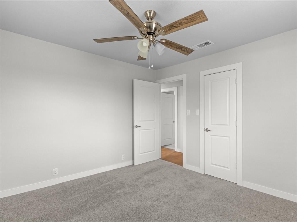 526 Jack Grace Hill Road Bowie, TX 76230 - Photo 9 of 34 an empty room with chandelier fan