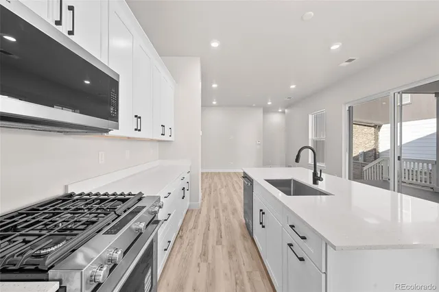 a view of kitchen with wooden floor