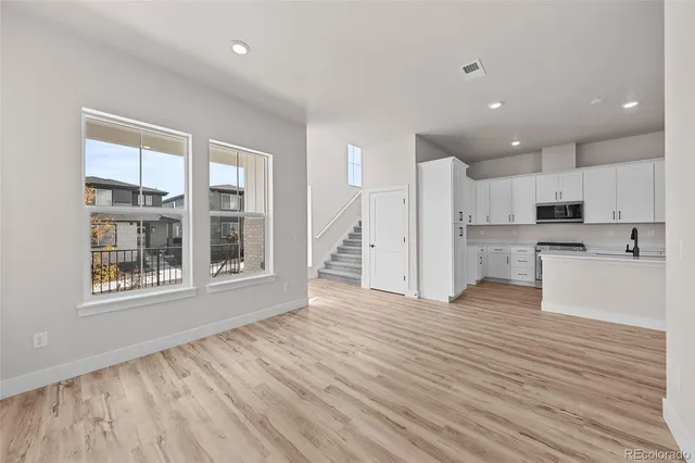 a bathroom with a sink toilet a mirror and shower
