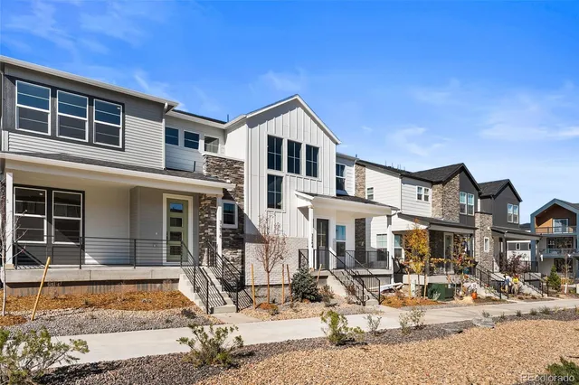 a view of a house with snow on the road