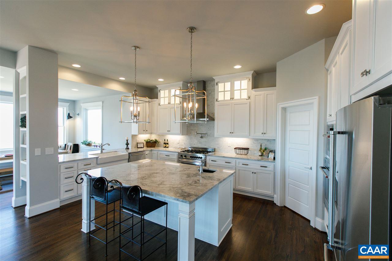 2412 Summit Ridge Trail Charlottesville, VA 22911 - Photo 12 of 41 a kitchen with refrigerator a stove and wooden floor