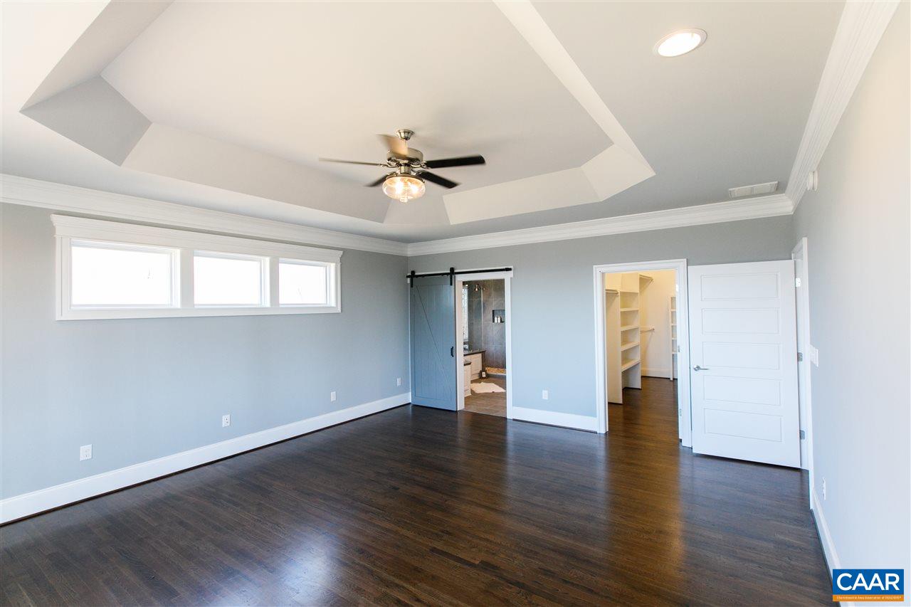 2412 Summit Ridge Trail Charlottesville, VA 22911 - Photo 18 of 41 an empty room with wooden floor and windows