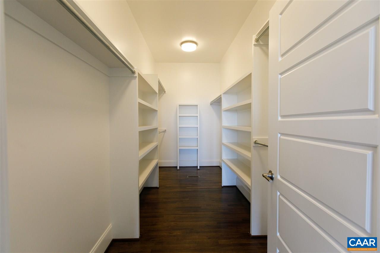 2412 Summit Ridge Trail Charlottesville, VA 22911 - Photo 19 of 41 a view of walk in closet with empty racks
