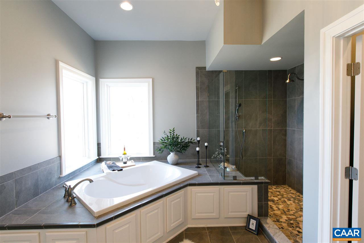 2412 Summit Ridge Trail Charlottesville, VA 22911 - Photo 24 of 41 a bathroom with a sink vanity granite tub and shower