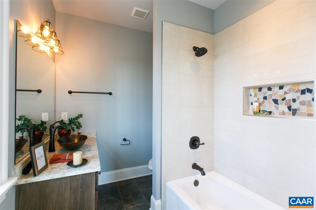 2412 Summit Ridge Trail Charlottesville, VA 22911 - Photo 35 of 41 a bathroom with a tub sink and mirror