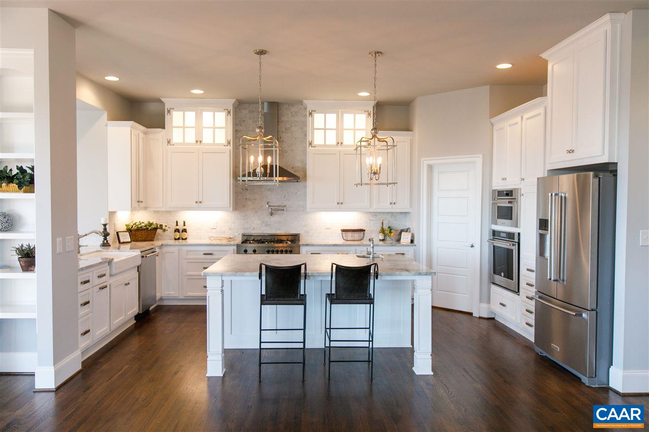 2412 Summit Ridge Trail Charlottesville, VA 22911 - Photo 10 of 41 a kitchen with white cabinets and stainless steel appliances