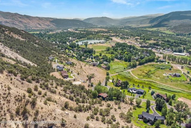 a view of a town with mountains in the background
