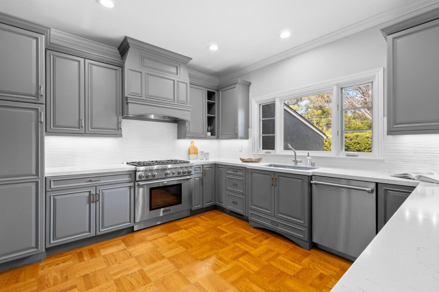 1536 Eastmoor Road Burlingame, CA 94010 - Photo 17 of 70 a kitchen with stainless steel appliances granite countertop a sink and cabinets