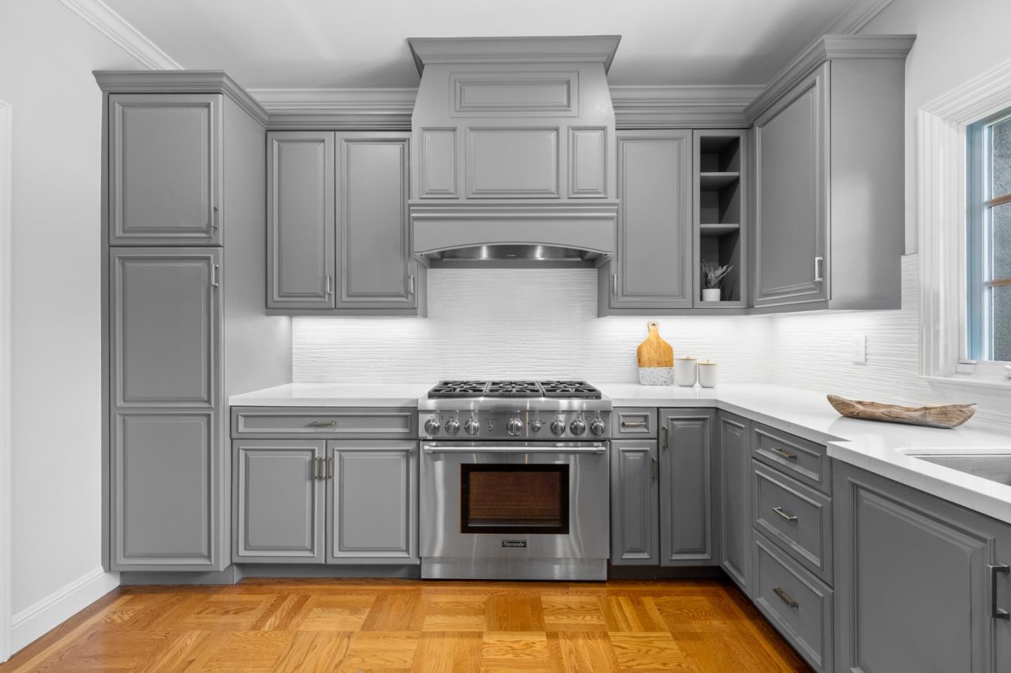 1536 Eastmoor Road Burlingame, CA 94010 - Photo 18 of 70 a kitchen with granite countertop a stove sink and cabinets