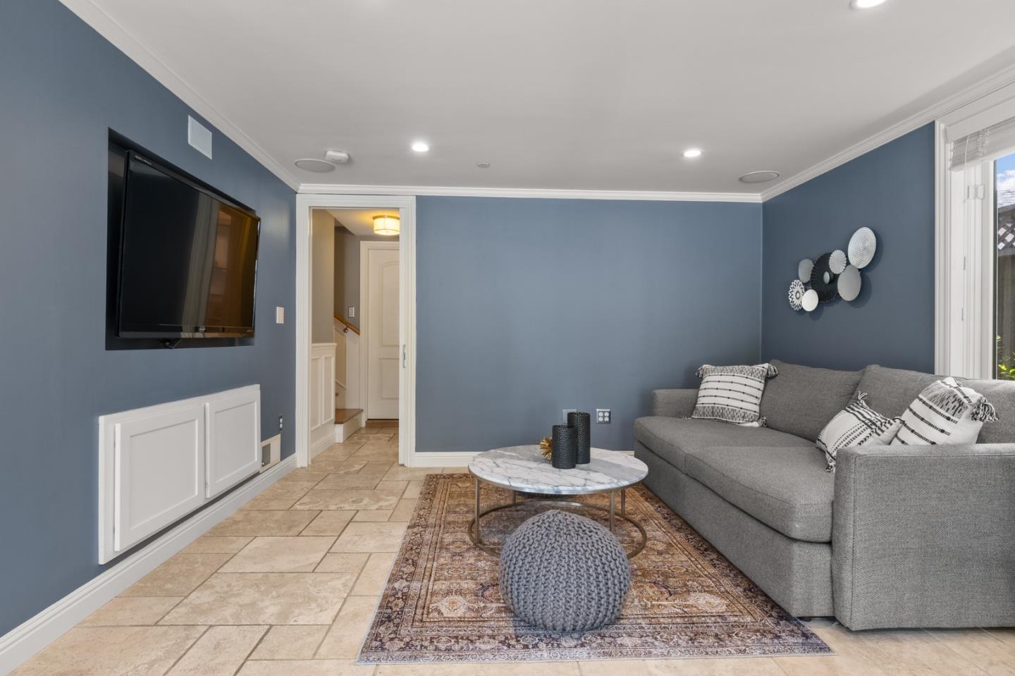 1536 Eastmoor Road Burlingame, CA 94010 - Photo 27 of 70 a living room with furniture and a flat screen tv
