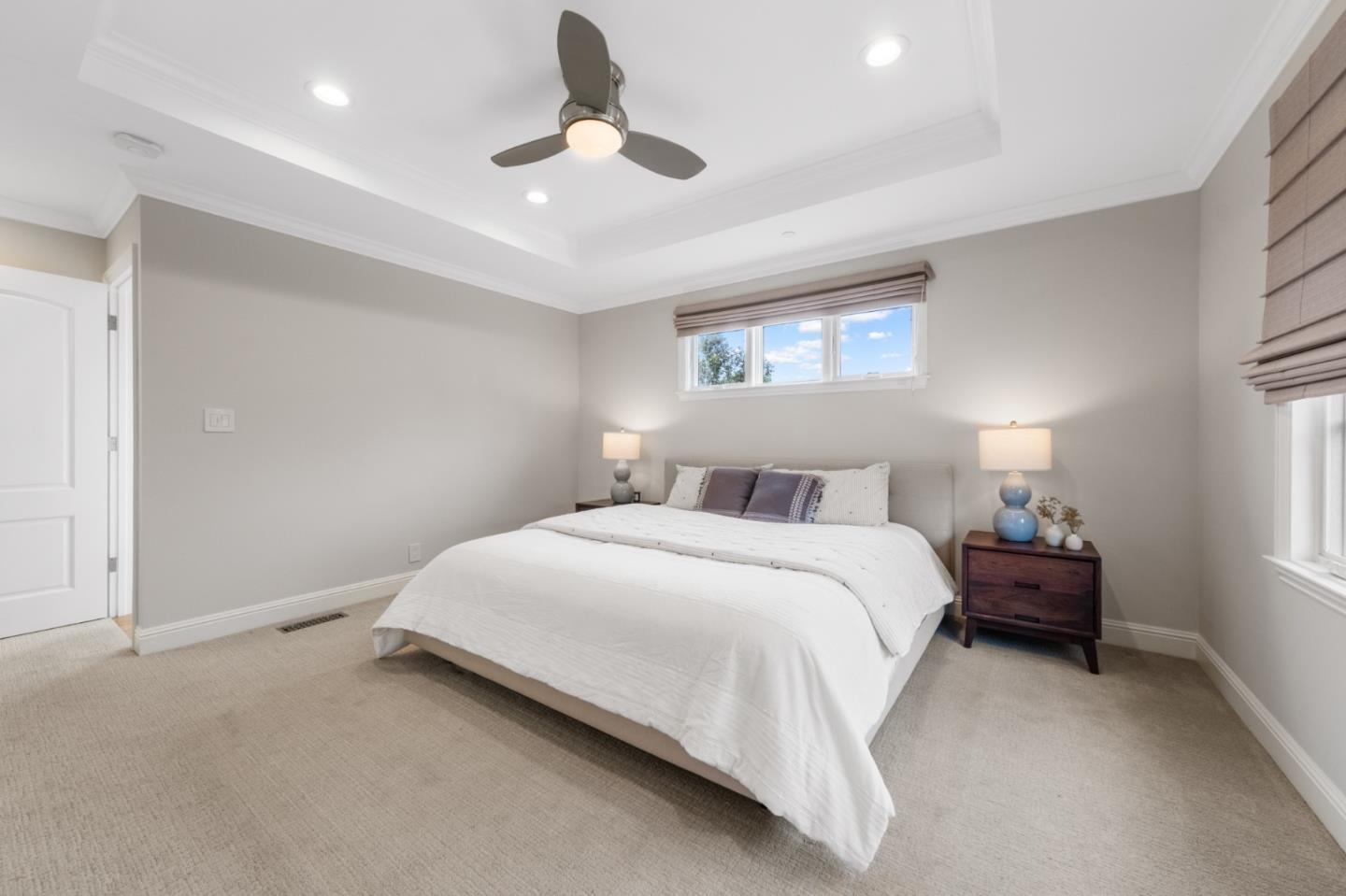 1536 Eastmoor Road Burlingame, CA 94010 - Photo 30 of 70 a bedroom with a bed and a ceiling fan