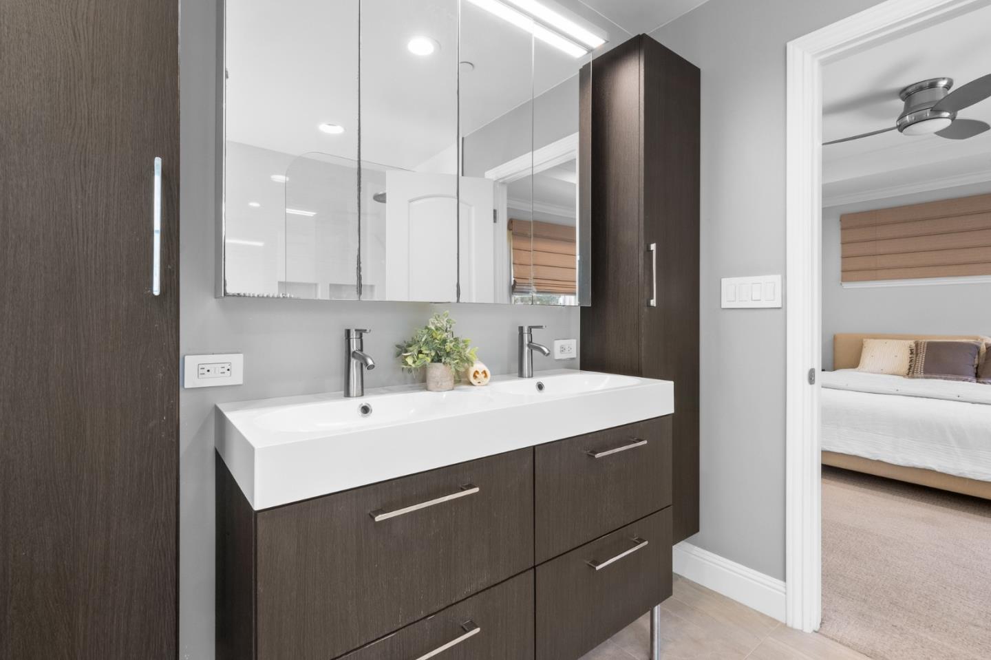1536 Eastmoor Road Burlingame, CA 94010 - Photo 33 of 70 a en suite bathroom with a sink and a mirror