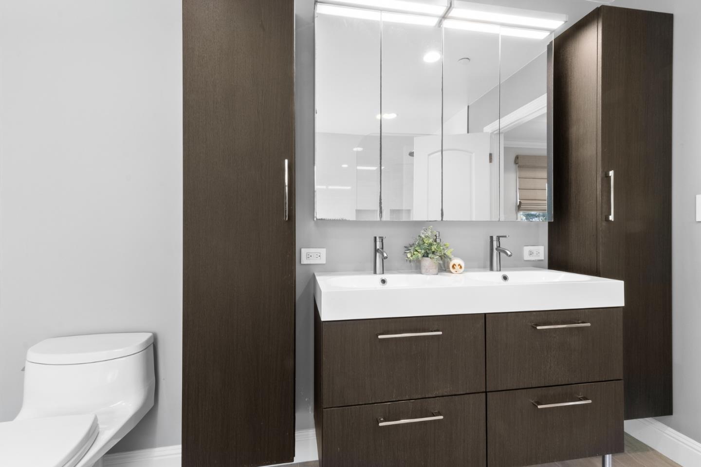 1536 Eastmoor Road Burlingame, CA 94010 - Photo 34 of 70 a view of a bathroom with a sink and mirror