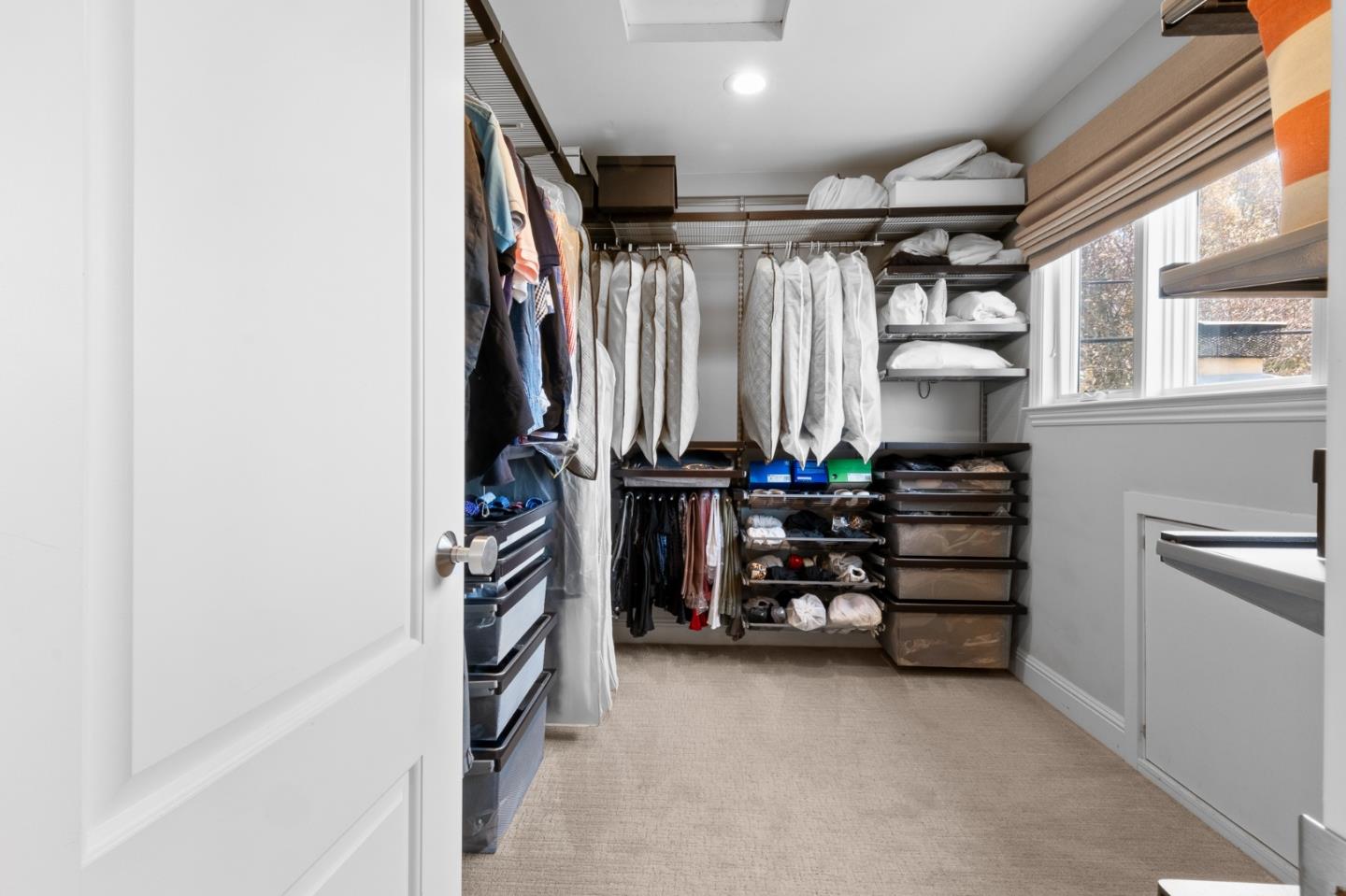 1536 Eastmoor Road Burlingame, CA 94010 - Photo 39 of 70 a view of walk in closet with clothes and shoes