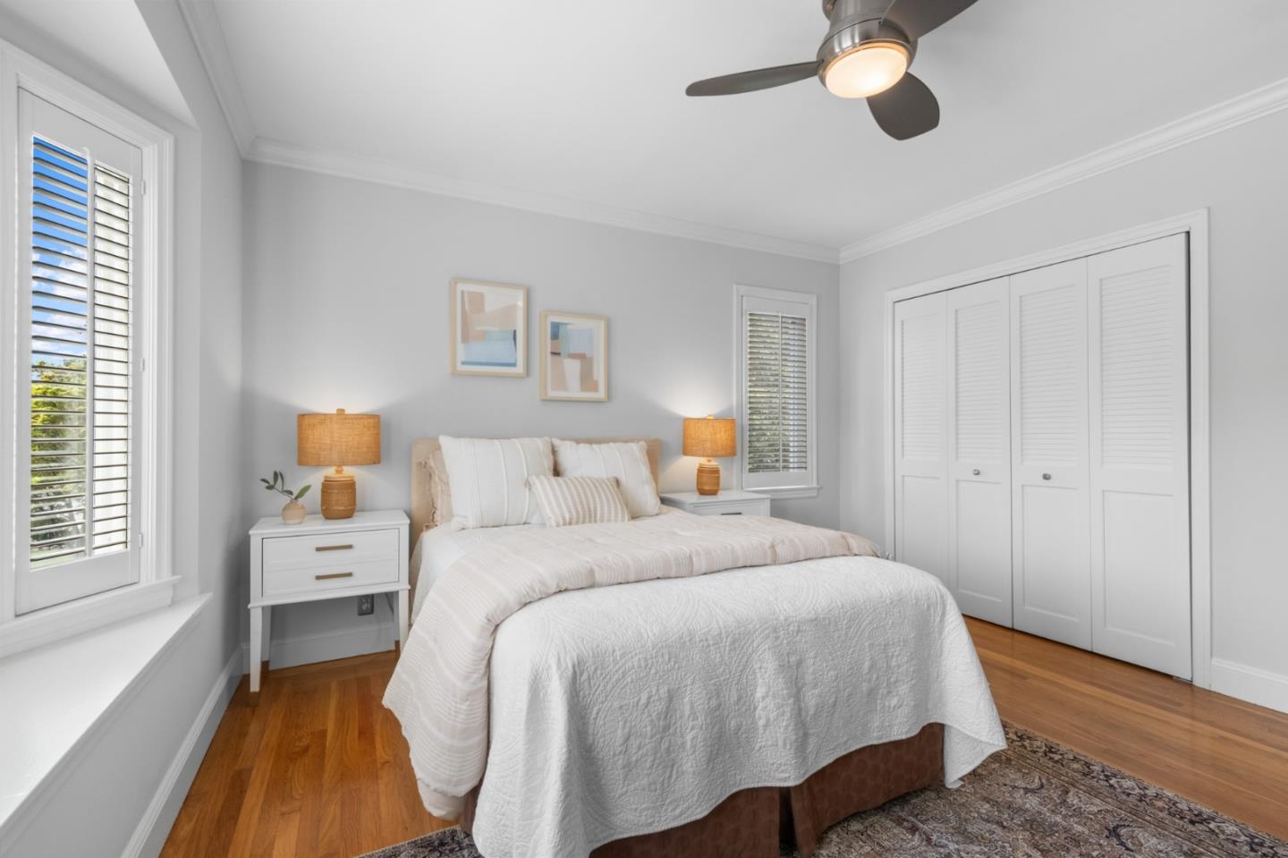 1536 Eastmoor Road Burlingame, CA 94010 - Photo 42 of 70 a bedroom with a bed and a chandelier