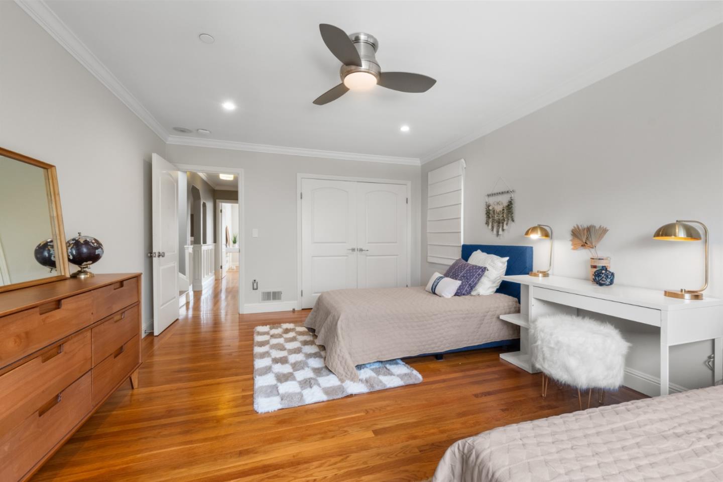 1536 Eastmoor Road Burlingame, CA 94010 - Photo 44 of 70 a bedroom with a bed and wooden floor