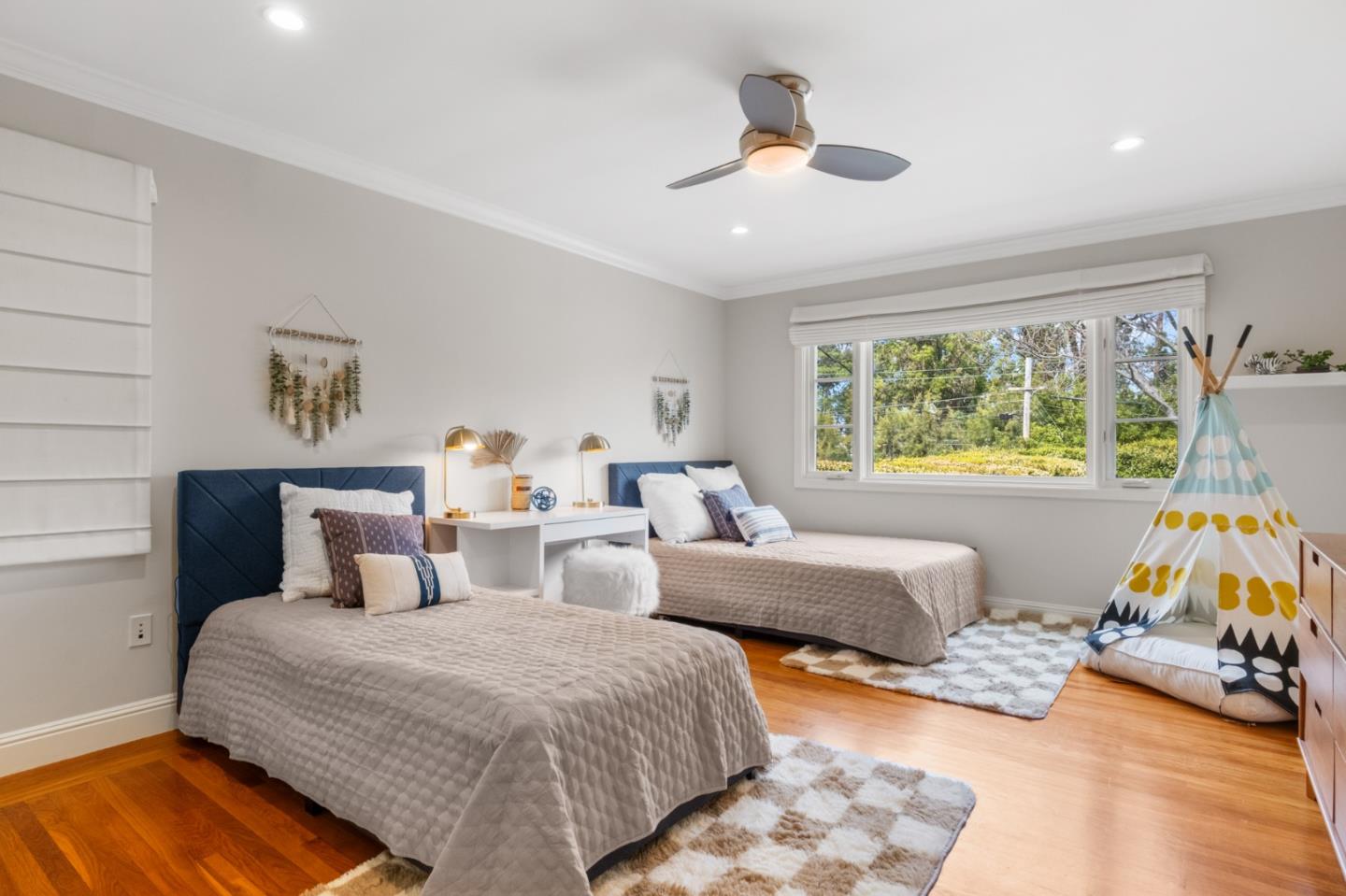 1536 Eastmoor Road Burlingame, CA 94010 - Photo 45 of 70 a bedroom with two beds and a chandelier