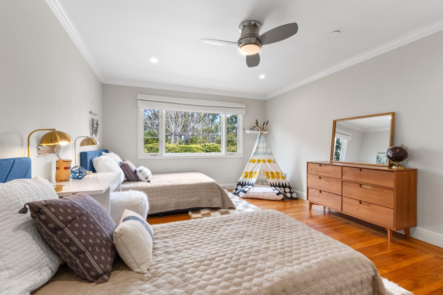 1536 Eastmoor Road Burlingame, CA 94010 - Photo 46 of 70 a bedroom with a bed and wooden floor