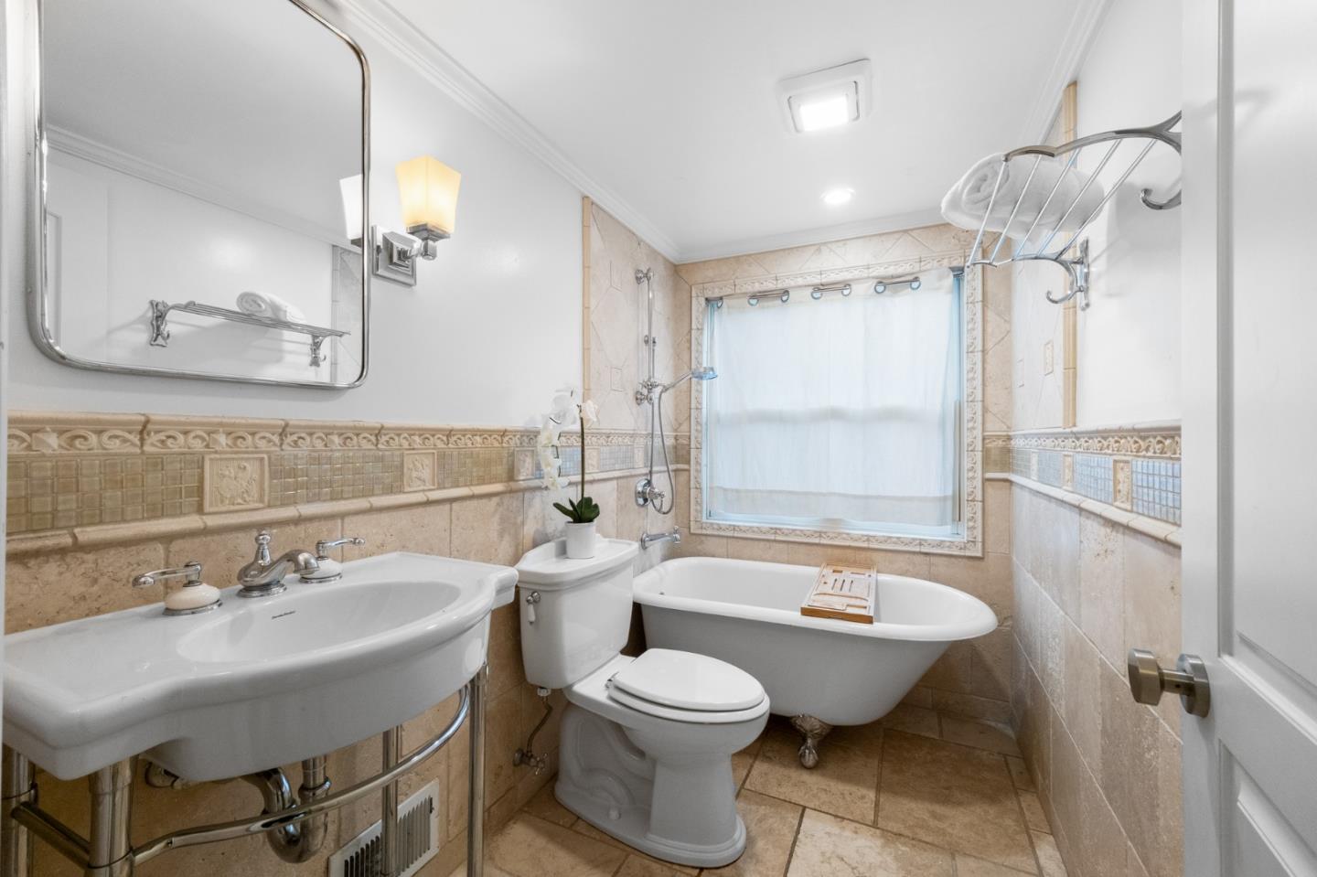1536 Eastmoor Road Burlingame, CA 94010 - Photo 49 of 70 a bathroom with a toilet sink and mirror