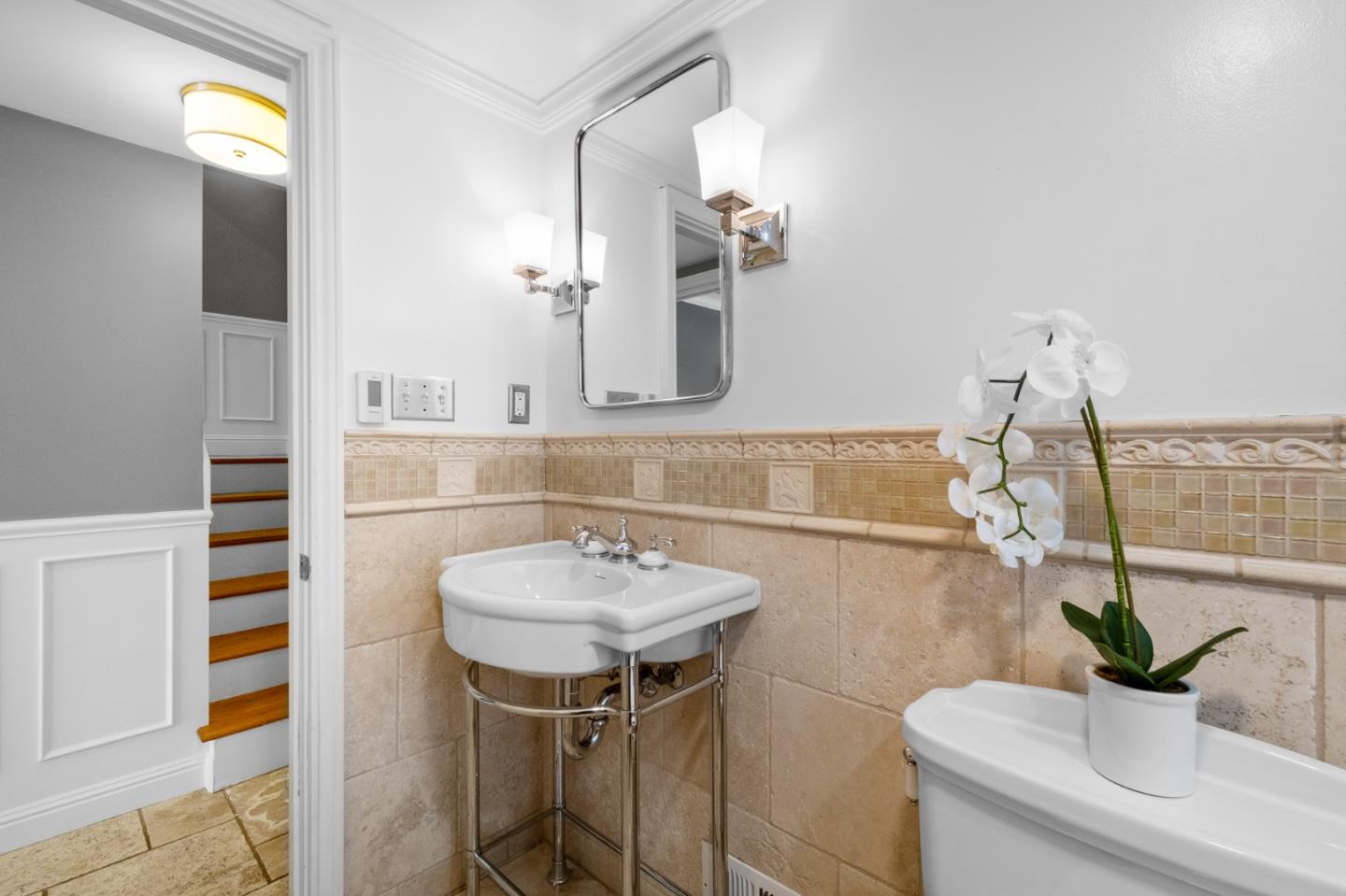 1536 Eastmoor Road Burlingame, CA 94010 - Photo 50 of 70 a bathroom with a sink and a mirror