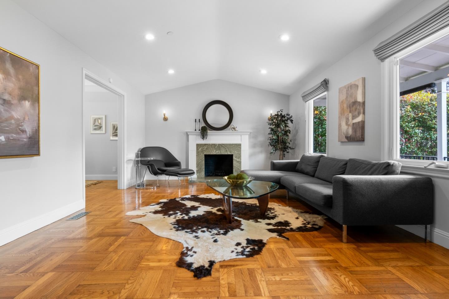 1536 Eastmoor Road Burlingame, CA 94010 - Photo 5 of 70 a living room with furniture a fireplace and a large window