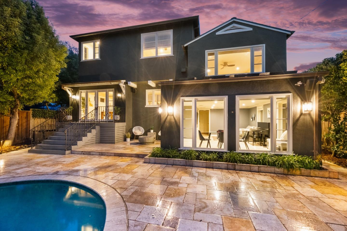 1536 Eastmoor Road Burlingame, CA 94010 - Photo 55 of 70 a view of a house with large windows and a yard