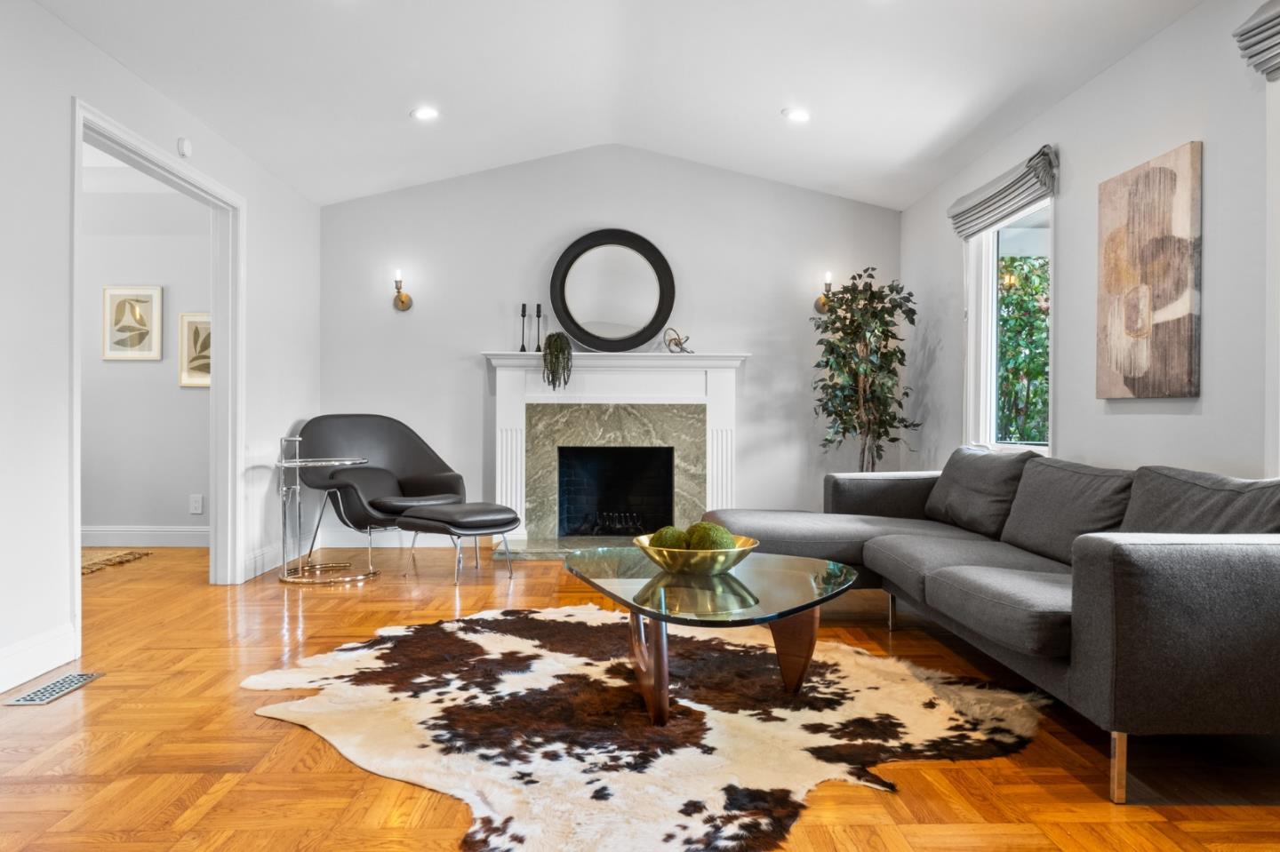 1536 Eastmoor Road Burlingame, CA 94010 - Photo 6 of 70 a living room with furniture a rug and a fireplace