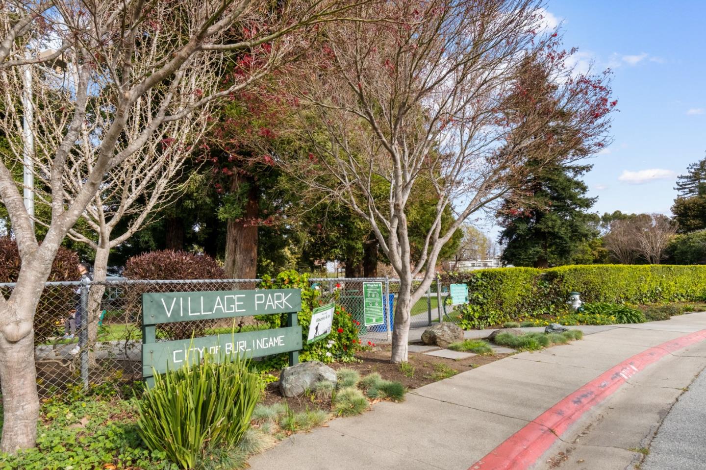 1536 Eastmoor Road Burlingame, CA 94010 - Photo 68 of 70 a view of a garden with a bench and trees