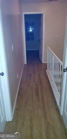 a bathroom with a toilet and a shower curtain