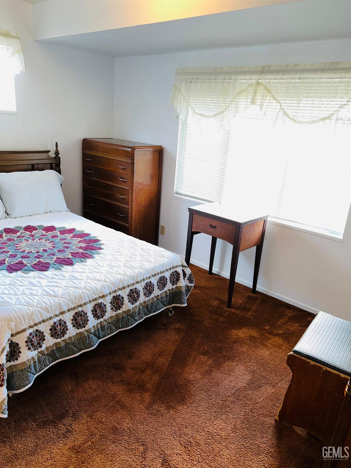 Undisclosed Address Bakersfield, CA 93305 - Photo 15 of 22 a bedroom with a bed and a window