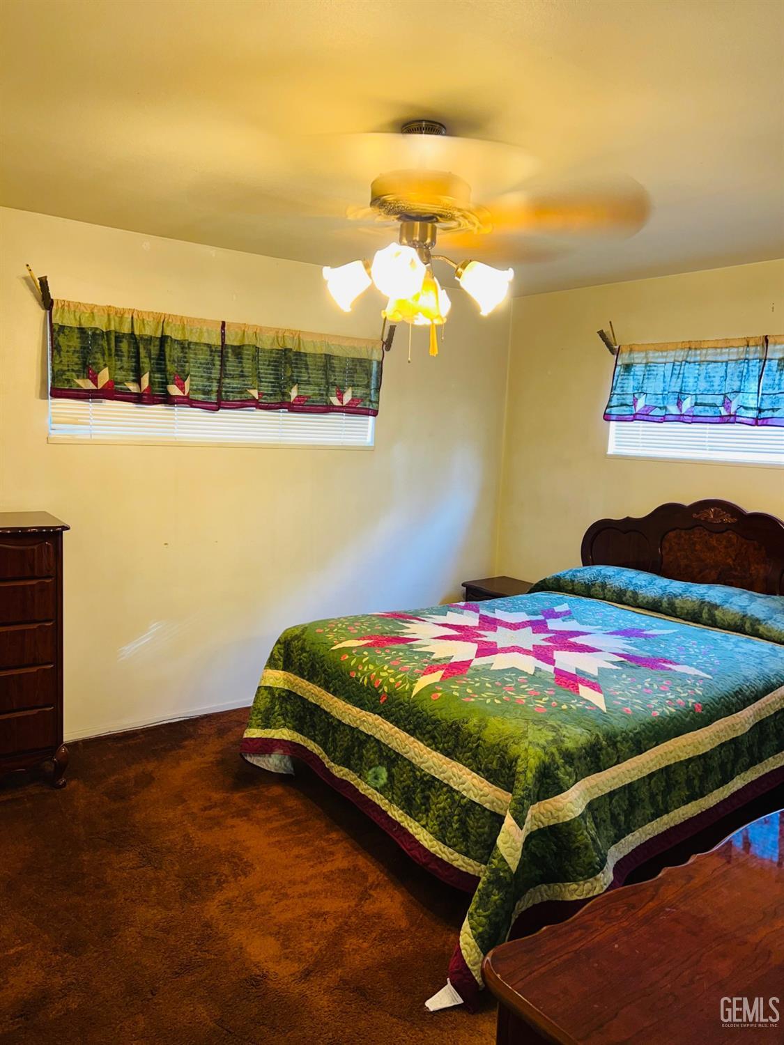 Undisclosed Address Bakersfield, CA 93305 - Photo 16 of 22 a bedroom with table and flowerpot