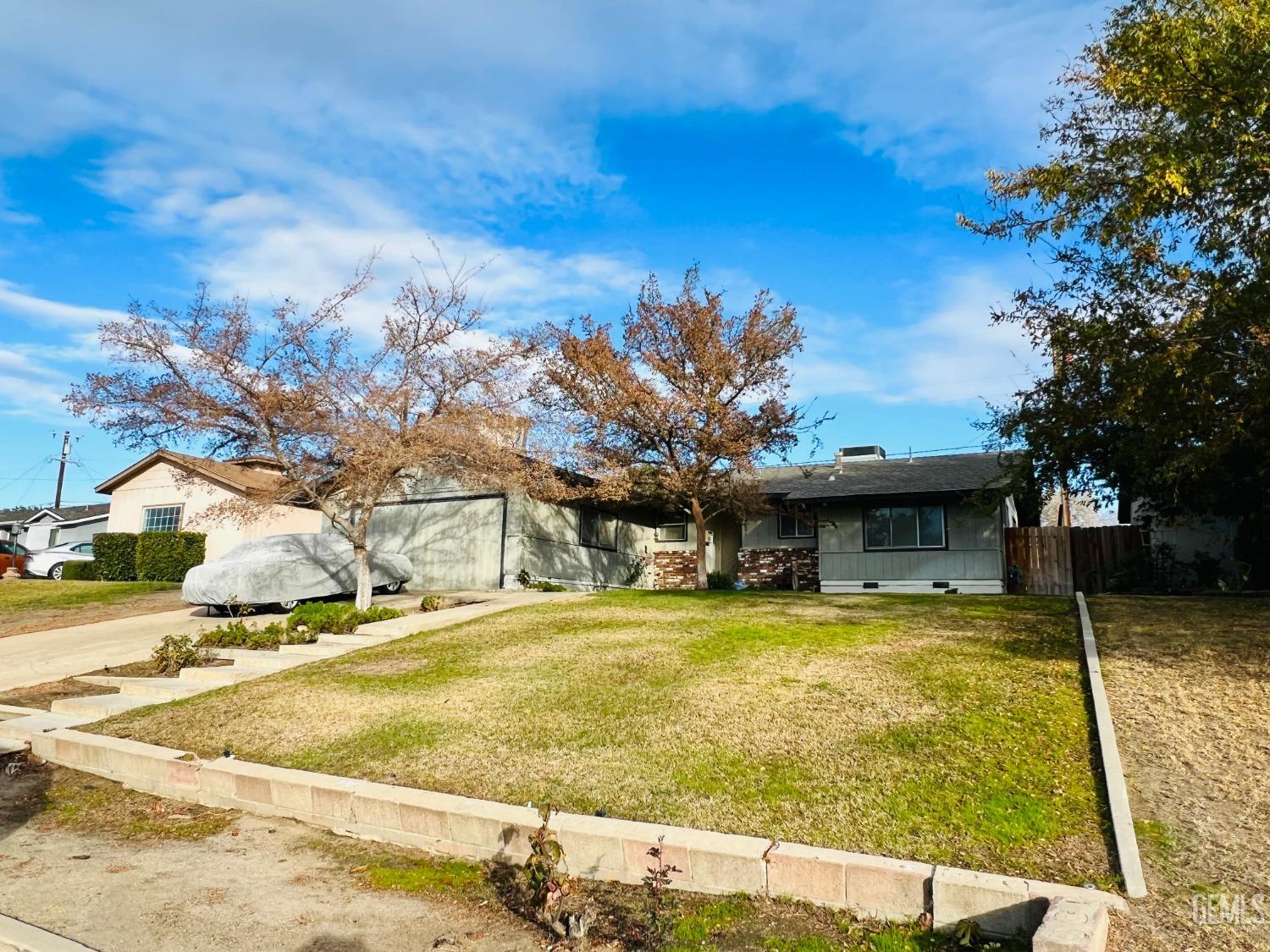Undisclosed Address Bakersfield, CA 93305 - Photo 2 of 22 a view of a swimming pool with an outdoor space and seating area