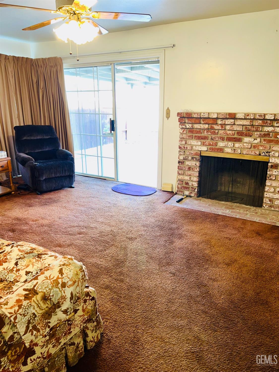 Undisclosed Address Bakersfield, CA 93305 - Photo 6 of 22 a view of livingroom with furniture and staircase