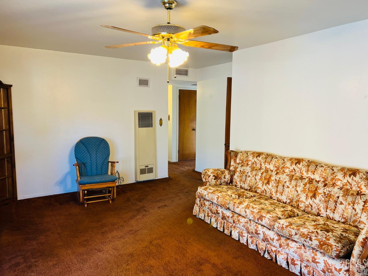 Undisclosed Address Bakersfield, CA 93305 - Photo 7 of 22 a living room with a bed