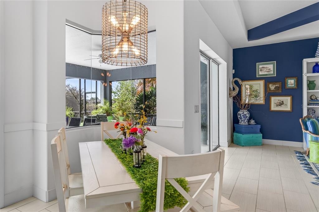 2440 Pawtucket Pass Mount Dora, FL 32757 - Photo 19 of 64 a very nice looking room with a large window and chandelier