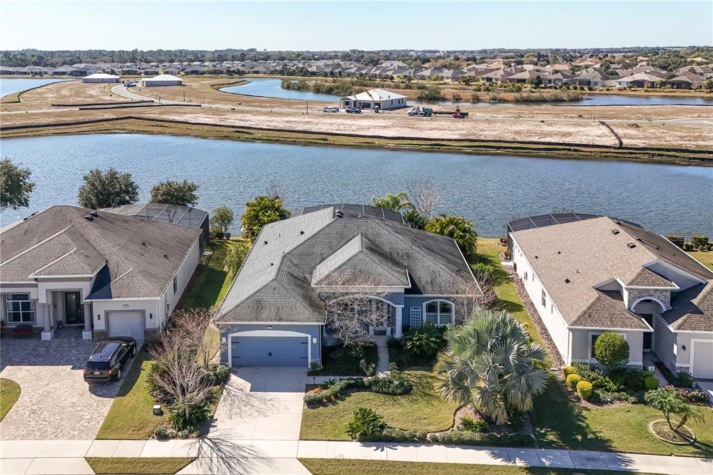 2440 Pawtucket Pass Mount Dora, FL 32757 - Photo 2 of 64 an aerial view of a house with a lake view