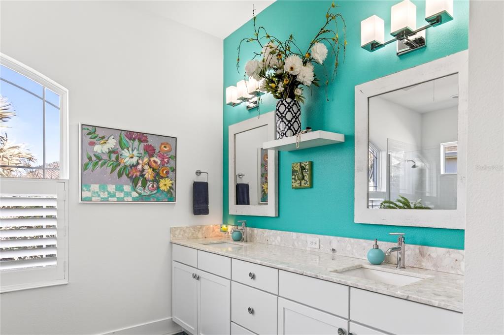 2440 Pawtucket Pass Mount Dora, FL 32757 - Photo 25 of 64 a bathroom with a sink a mirror and a window