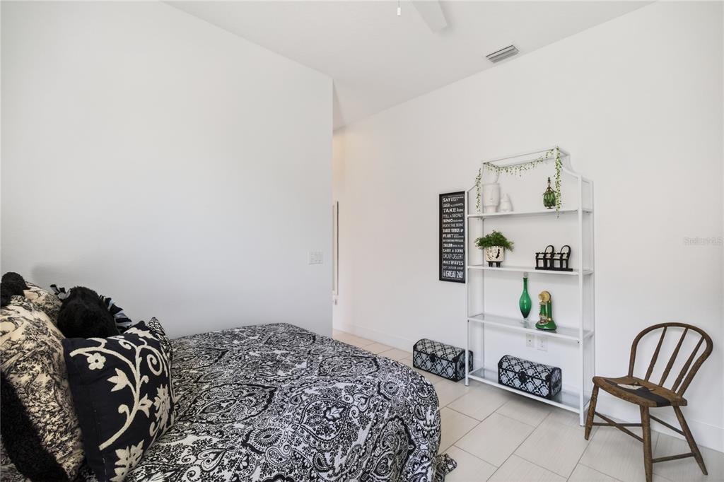 2440 Pawtucket Pass Mount Dora, FL 32757 - Photo 35 of 64 a bedroom with a bed and dresser