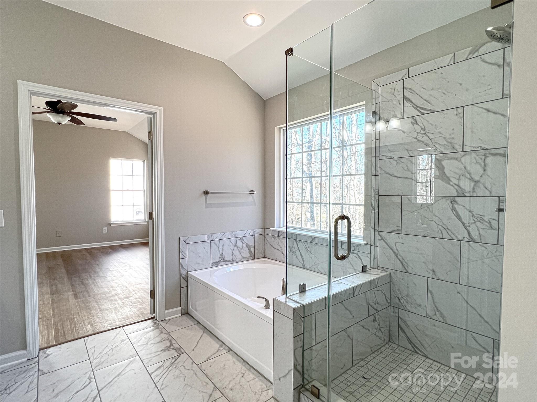 1644 Heather Glen Road Kannapolis, NC 28081 - Photo 18 of 25 a bathroom with a tub and a shower