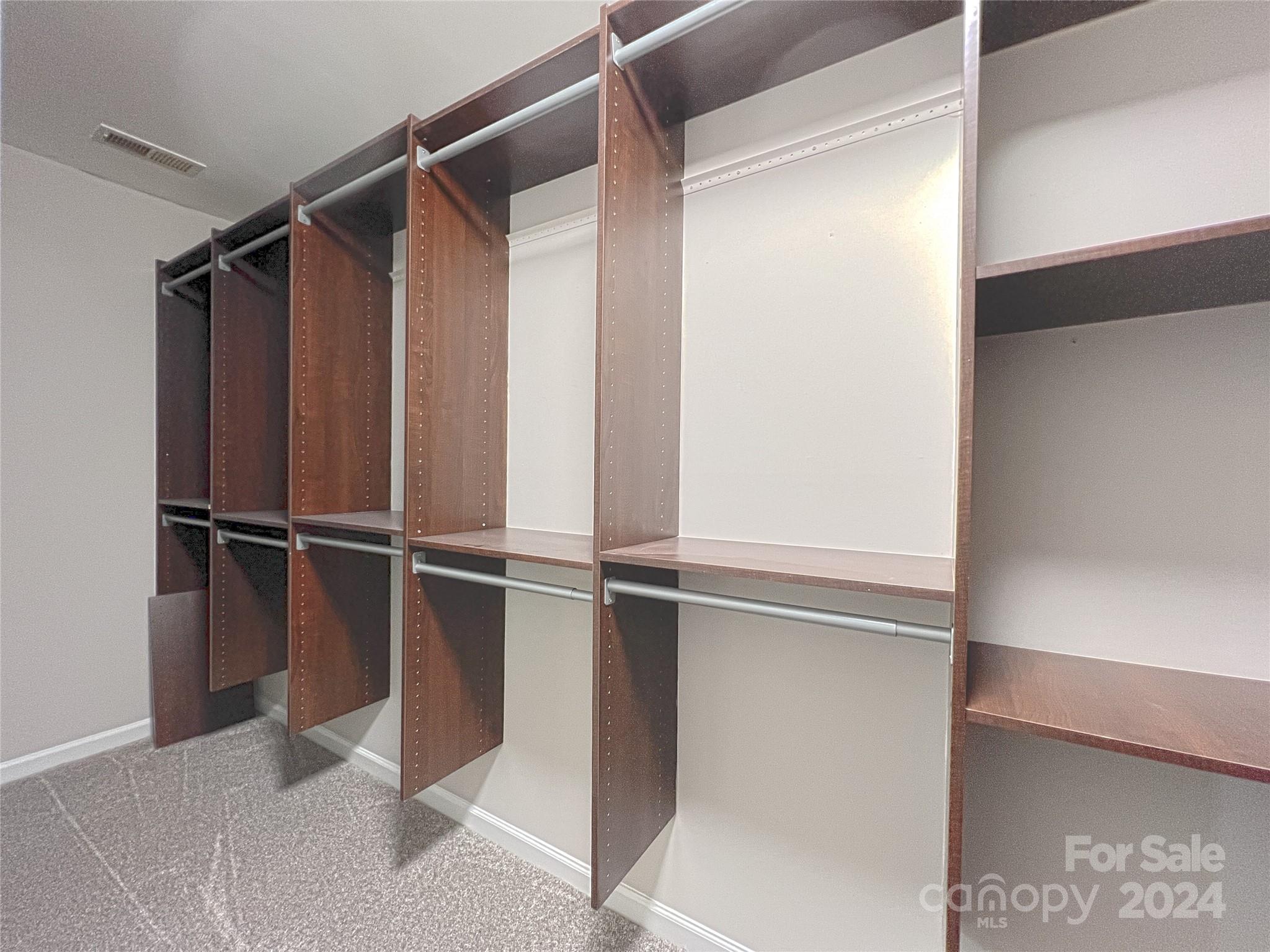 1644 Heather Glen Road Kannapolis, NC 28081 - Photo 20 of 25 a view of walk in closet with empty racks