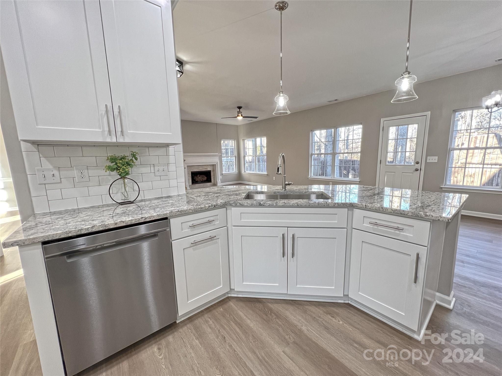 1644 Heather Glen Road Kannapolis, NC 28081 - Photo 4 of 25 a kitchen with white cabinets appliances and a sink