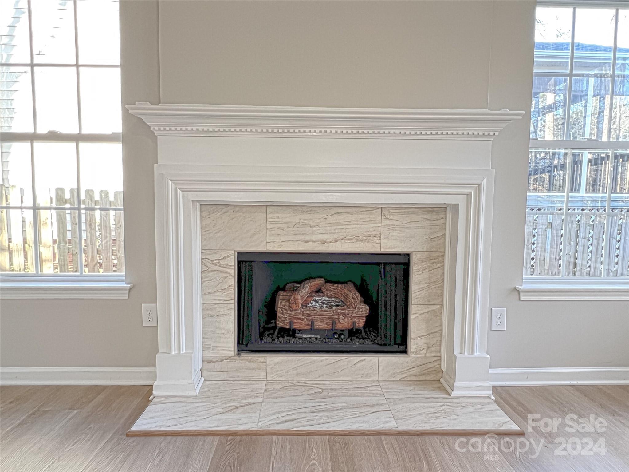 1644 Heather Glen Road Kannapolis, NC 28081 - Photo 9 of 25 a living room with a fireplace and a fireplace