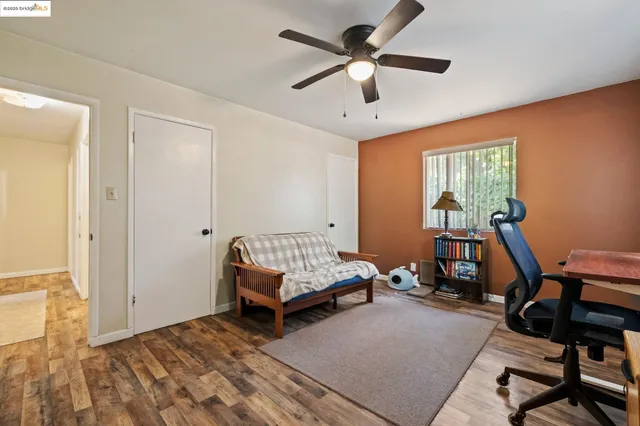 a bedroom with furniture and a window