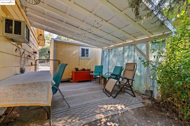 a view of a room with furniture and a rug